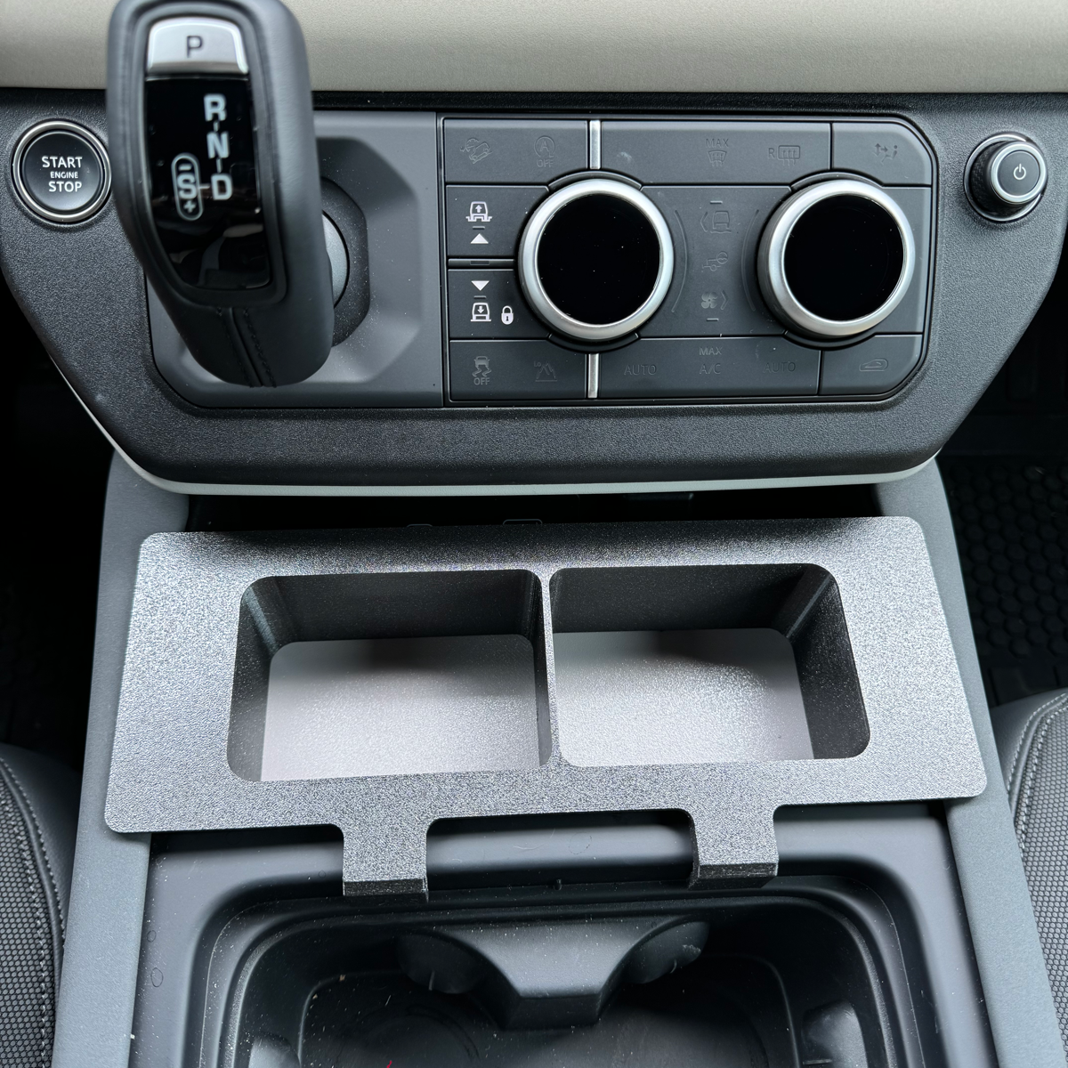 Land Rover Defender storage caddy console for practical storage.