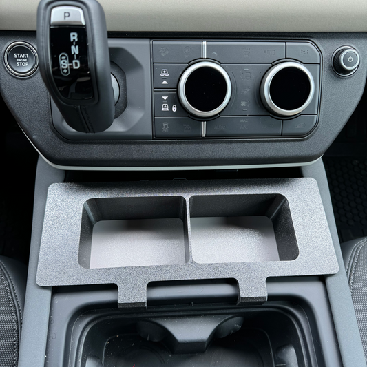 Land Rover Defender storage caddy console for practical storage.