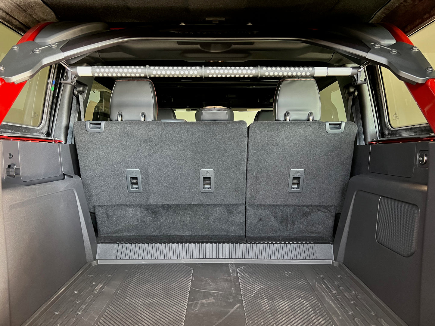 Garment rod mounted in the Ford Bronco with gear hooks