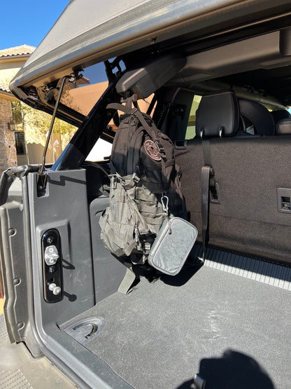 Ford Bronco gear hooks holding backpack, full image
