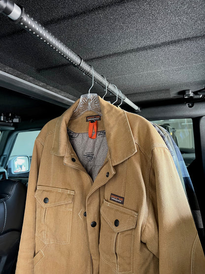 Garment rod displayed with clothes hanging from hooks in Ford Bronco